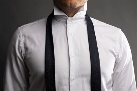 How to Tie a Four In Hand Knot (Step-By-Step Guide) - The Modest Man