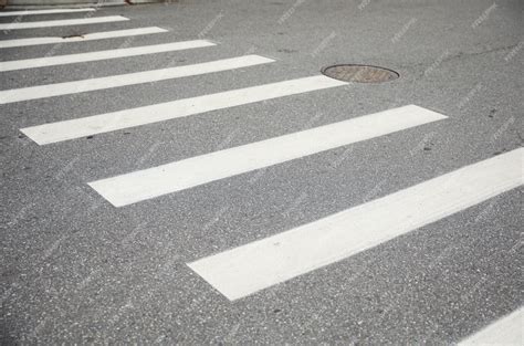 Premium Photo | Vibrant crosswalk on a busy street represents unity safety and a shared path in ...