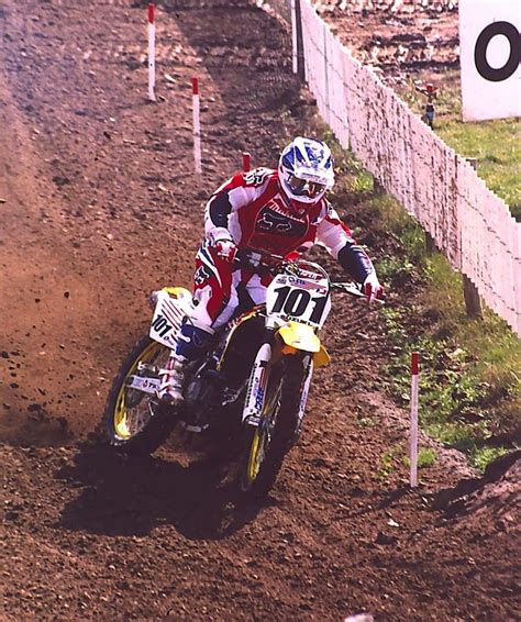 a man riding on the back of a dirt bike