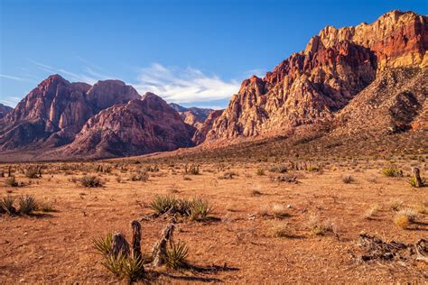 The rugged arid landscape of Nevadas Red Rock Canyon stretches into the distance. See more # ...