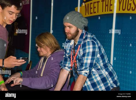 Paul Sykes, also known as Sjin with Duncan Jones behind talking to fans at Insomnia55 the Ricoh ...