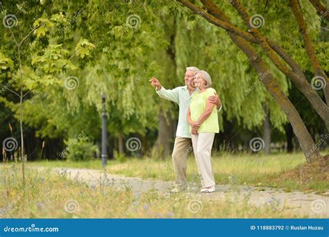 Happy Senior Couple in Park Outdoors Stock Photo - Image of lifestyle, lady: 118883792