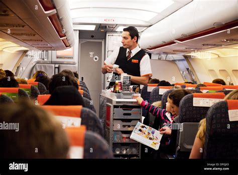 Easyjet cabin crew: Easyjet airline cabin crew staff in the plane Stock ...