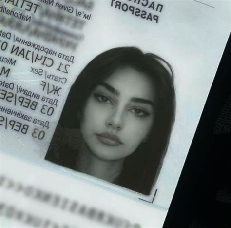 an id card with a woman's face and name is seen in this image