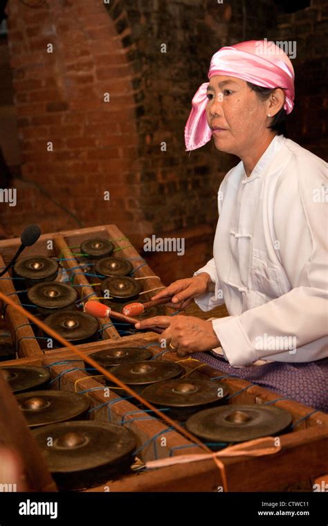 Myanmar, Burma. Bagan. Burmese Musician Playing Brass Gong (Maung Saing ...