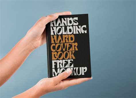 Free Hand Holding Hardcover Book Mockup PSD - Good Mockups