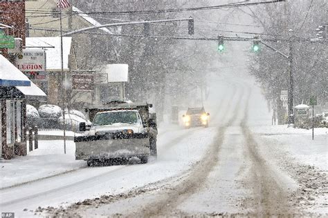 Storm Izzy brings up to 20 INCHES of snow to Ohio, cancels 1,700 ...