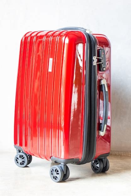 Premium Photo | Red travel suitcase for outgoing