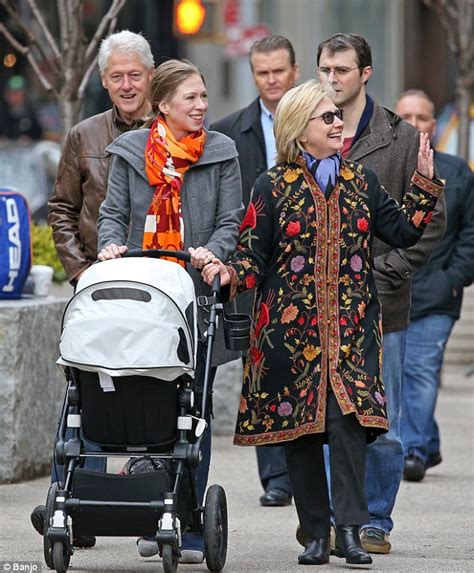 Baby on board! Pregnant Chelsea Clinton takes a Christmas stroll around ...