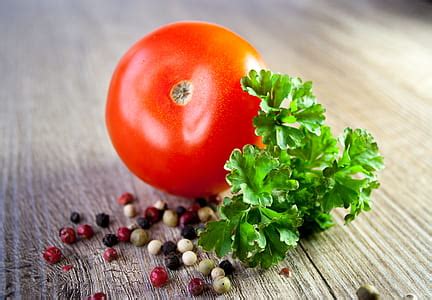 Royalty-Free photo: Ripe tomato with green relish | PickPik