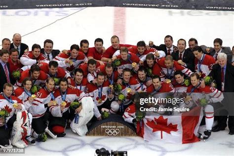 Team Canada poses for a team photo with their gold medals after... News ...