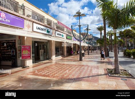 COSTA ADEJE, TENERIFE, SPAIN-CIRCA JAN, 2016: Stores and restaurants are in center of city ...