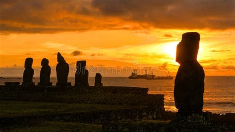 COPY SPACE: Sunset Illuminates the Moai Statues and Fishing Boats in ...