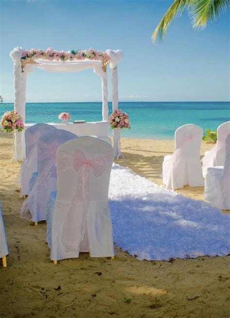 an outdoor wedding set up on the beach