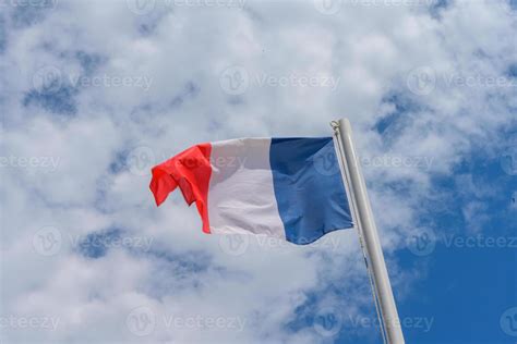 French flag waving in the wind 10753010 Stock Photo at Vecteezy