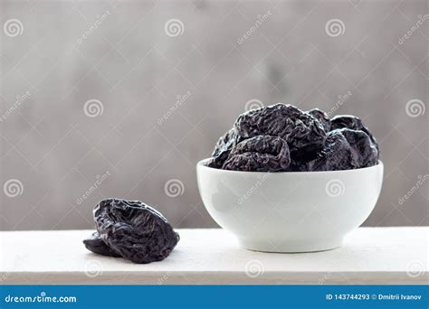 Dried Prunes in a White Bowl Stock Image - Image of dessert, dietary ...