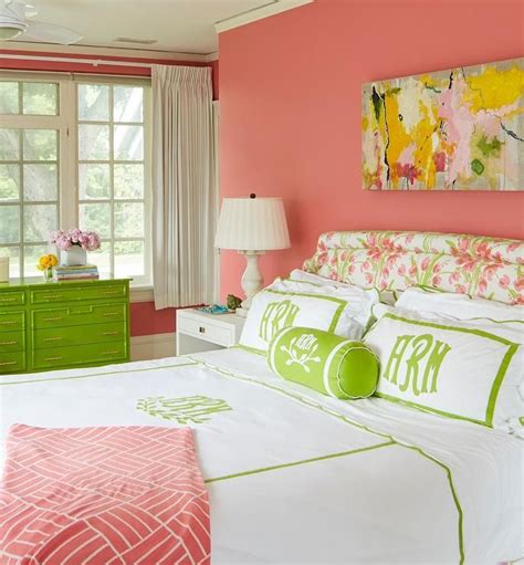 Lovely salmon pink girl's bedroom features a bed fitted with a pink and green chintz headboard ...