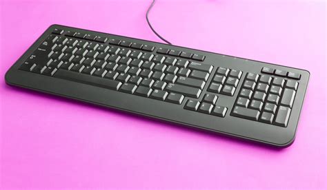 Free Stock Photo 12712 Black computer keyboard on pink | freeimageslive