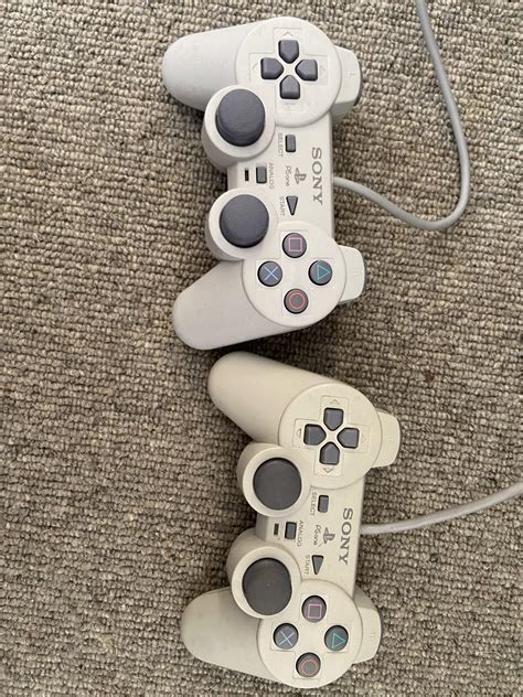 A now opened new PlayStation 1 Controller compared to a like new ...