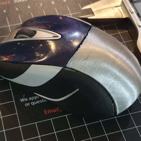 3D Printable Logitech M525 Mouse Battery Cover by Steve Hanov