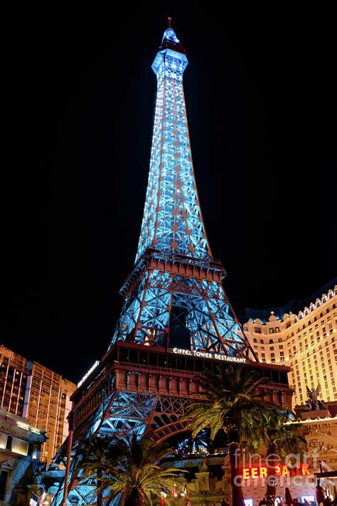 Paris Casino Eiffel Tower Light Show With Blue Lights Photograph by Aloha Art - Fine Art America