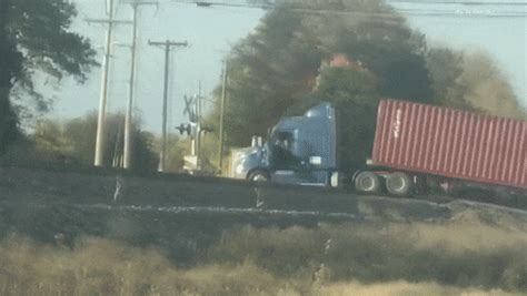 Watch A Freight Train Completely Destroy A Stuck Semi-Truck In Indiana | Carscoops