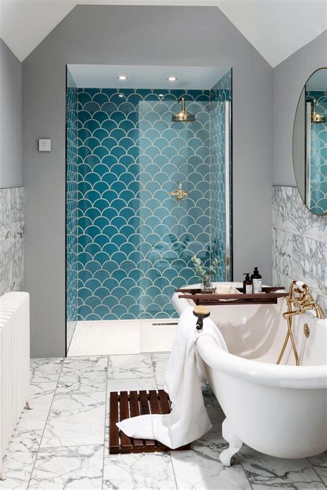 Incorporating a statement blue tile into this stylish en-suite gives it ...