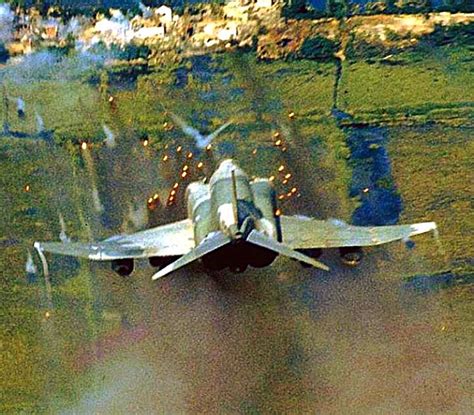 A USAF F-4 Phantom unleashes its fury on the enemy during the Vietnam war. | Vietnam, Military ...