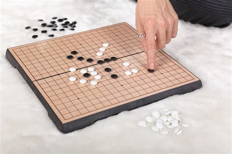 Boardgame Reversi Game In Action Stock Photo - Download Image Now - iStock