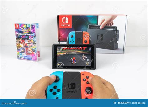 Playing Mario Kart Deluxe 8 in Nintendo Switch Editorial Stock Image ...