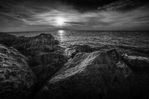 Ottawa Beach Sunset In Black And White From The Channel Rocks Photograph by Randall Nyhof