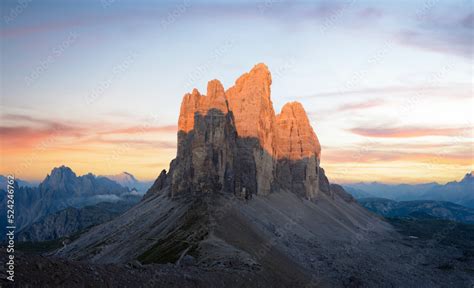 Stunning view of the Three Peaks of Lavaredo, (Tre cime di Lavaredo) during a beautiful sunrise ...