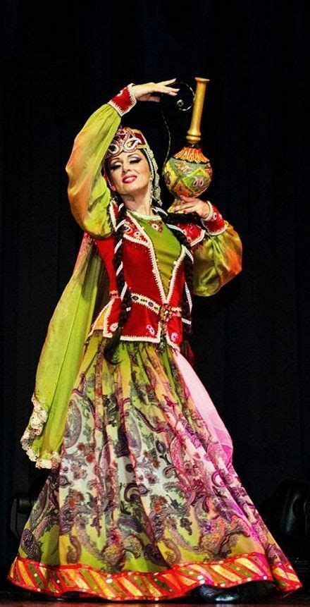 ARAB DANCER A dancer in traditional festive costume, from Azerbaijan ...