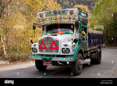 Decorated colourful heavy goods lorry TATA in mountain road, Bhutan ...