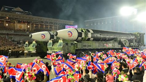 North Korean Leader Mum as Military Parade Rolls Out Largest ICBM Display