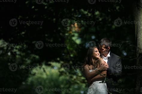 Beautiful wedding couple posing in forest 11745973 Stock Photo at Vecteezy