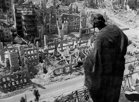 A statue looks over bombed out Dresden during WWII : pics