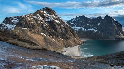 Fresh stream of water flowing towards Kvalvika beach, Moskenesøya, Lofoten islands, Norway ...