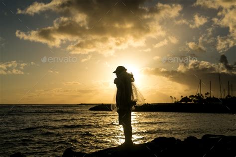 Fisherman at Sunset. Stock Photo by leggybirdphotos | PhotoDune