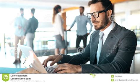 Professional Businessman Working on Laptop in Office Stock Photo - Image of handsome, computer ...