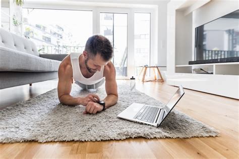 Premium Photo | Handsome man working out at home