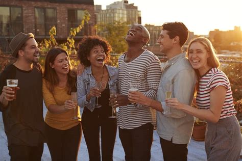 Friends Drinking and Laughing at a Rooftop Party in Brooklyn Stock Photo - Image of group ...