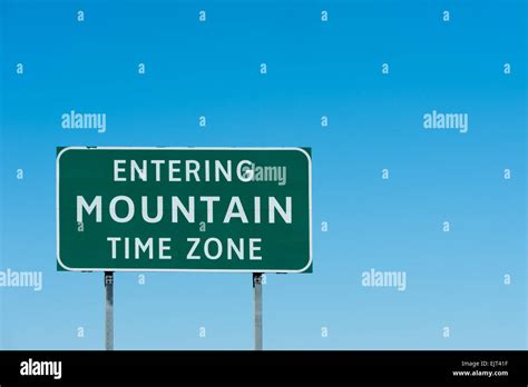 Road sign with Mountain time zone, New Mexico Stock Photo - Alamy