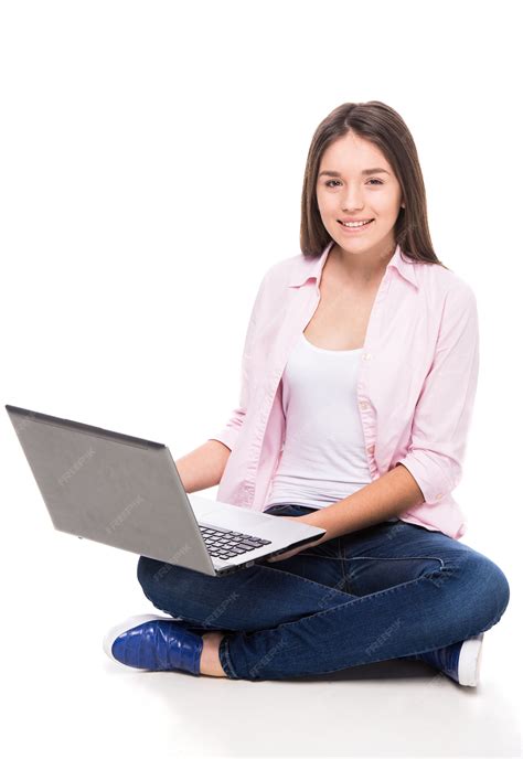 Premium Photo | Smiling girl with is sitting on the floor with laptop.