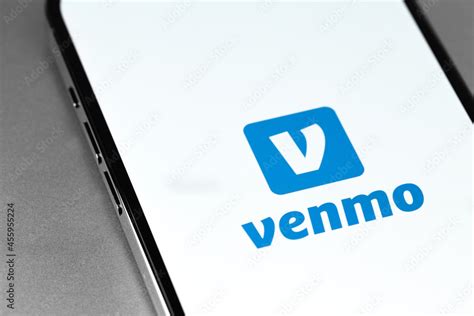 Venmo logo mobile app on screen smartphone iPhone closeup. Venmo is a ...