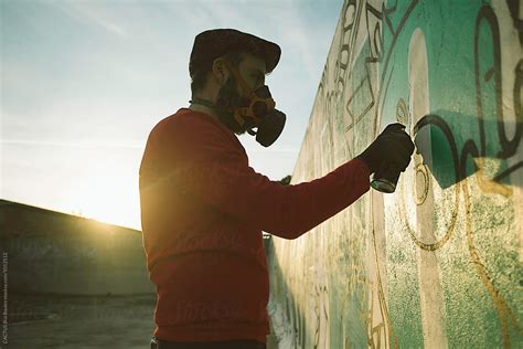 "Man Painting In A Graffiti Wall" by Stocksy Contributor "CACTUS Creative Studio" - Stocksy