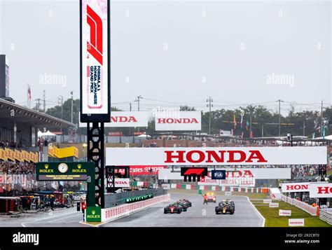 SUZUKA, JAPAN, Suzuka Circuit, 9. October: A marshall signals the start ...