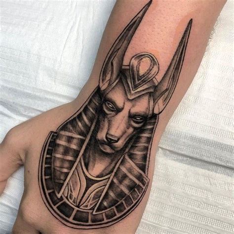 16 Powerful Anubis Tattoo Designs with Meaning | Tattoodo | Egyptian eye tattoos, Anubis tattoo ...