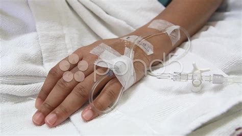 Closeup Saline Drip Into Patient Hand On Bed In Hospital Stock Video ...