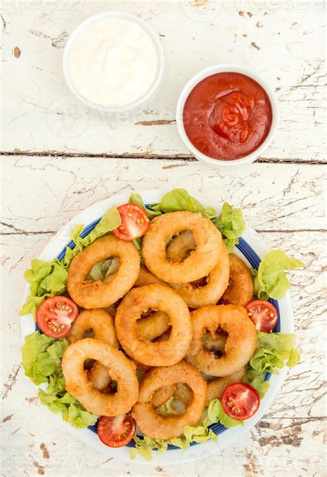 Fried squid rings 22860871 Stock Photo at Vecteezy